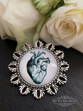 Load image into Gallery viewer, Anatomical Heart Pin Brooch - Vintage Illustration - Glass Photo Cabochon - Antiqued Silvertone Base - 4cm x 4cm (1.57 Inch Diameter)