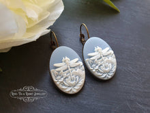 Load image into Gallery viewer, Dragonfly Cameo Earrings - Birds Egg Blue/White - 3.7x1.9cm (1.45x0.74 Inches) - Hinged Closure - Antiqued Bronze Base - Lead/Nickle Free