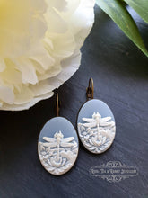 Load image into Gallery viewer, Dragonfly Cameo Earrings - Birds Egg Blue/White - 3.7x1.9cm (1.45x0.74 Inches) - Hinged Closure - Antiqued Bronze Base - Lead/Nickle Free