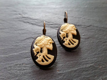 Load image into Gallery viewer, Skeleton Lady Cameo Drop Earrings - 3.7x1.9cm(1.45 x 0.74 Inches) - Black and Ivory Tones - Antiqued Bronze Tone Base - Lever Back Closure