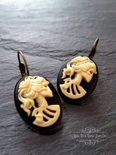 Load image into Gallery viewer, Skeleton Lady Cameo Drop Earrings - 3.7x1.9cm(1.45 x 0.74 Inches) - Black and Ivory Tones - Antiqued Bronze Tone Base - Lever Back Closure