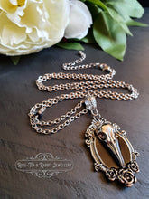 Load image into Gallery viewer, Striking Crow Skull Pendant Necklace - Antiqued Silvertone Finish - Black Enamel Detail - Gothic Modern-Vintage Style