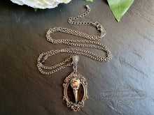 Load image into Gallery viewer, Striking Crow Skull Pendant Necklace - Antiqued Silvertone Finish - Black Enamel Detail - Gothic Modern-Vintage Style