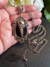 Load image into Gallery viewer, Striking Crow Skull Pendant Necklace - Antiqued Silvertone Finish - Black Enamel Detail - Gothic Modern-Vintage Style