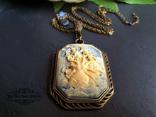 Load image into Gallery viewer, Awaken the Kraken! Actually, maybe don't. That never ends well. Just wear him as an epic fashion accessory instead! This truly stunning contemporary resin cameo is set in a beautiful antiqued bronze-finish base and features a fire polished ocean blue faceted crystal and a tiny scallop shell charm in blackened brass worked into the chain length. The chain itself comes in the three lengths for you to choose from. The pendant itself is sublimely dramatic and measures 7x4cm (70x40mm/2.75x1.57 Inches)