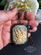 Load image into Gallery viewer, Kraken Cameo Pendant Necklace, Antiqued Bronze Finish, Ocean Blue Crystal Detail, Scallop Shell Charm, 7x4cm(70x40mm/2.75x1.57 Inches)