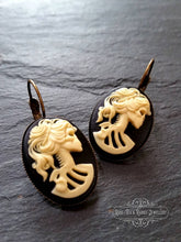 Load image into Gallery viewer, Skeleton Lady Cameo Drop Earrings - 3.7x1.9cm(1.45 x 0.74 Inches) - Black and Ivory Tones - Antiqued Bronze Tone Base - Lever Back Closure
