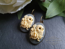Load image into Gallery viewer, Sugar Skull with Roses Cameo Earrings - Ivory Toned Relief on Soft Grey Background - 37x19mm (1.45 x 0.74 Inches) - Pretty Alt-Vintage Style
