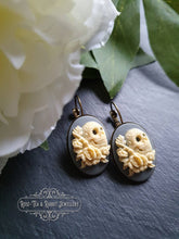Load image into Gallery viewer, Sugar Skull with Roses Cameo Earrings - Ivory Toned Relief on Soft Grey Background - 37x19mm (1.45 x 0.74 Inches) - Pretty Alt-Vintage Style
