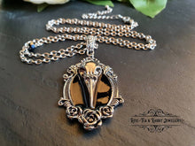 Load image into Gallery viewer, Striking Crow Skull Pendant Necklace - Antiqued Silvertone Finish - Black Enamel Detail - Gothic Modern-Vintage Style
